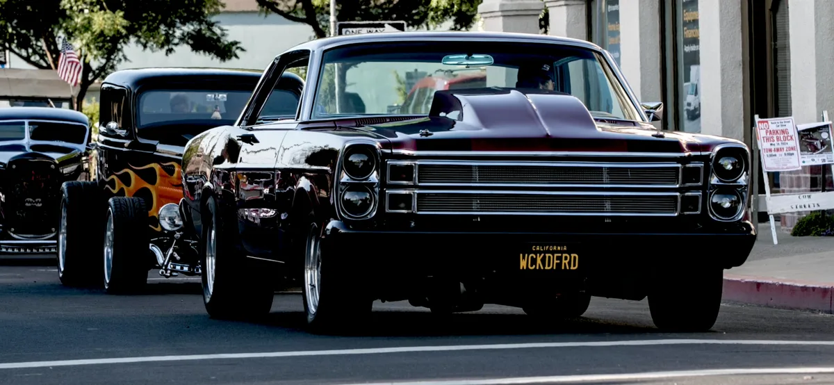 Black Plymouth Fury with chrome details at car show